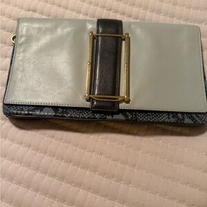 Elegant multi color leather cluch. Excellent condition.
